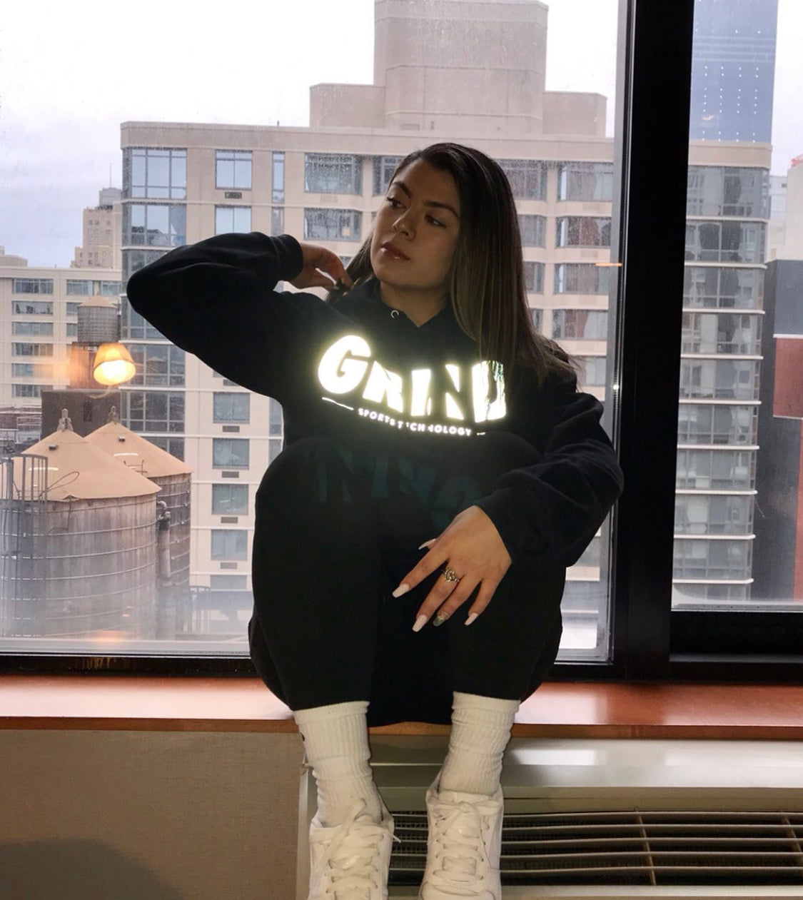 Sudadera con capucha reflectante